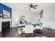 Bright living room with a fireplace, dark hardwood flooring, and comfortable seating at 8204 Yaxley Hall Dr, Raleigh, NC 27616