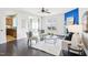 Bright open living space features a fireplace, hardwood flooring, and comfortable seating at 8204 Yaxley Hall Dr, Raleigh, NC 27616