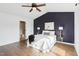 Inviting main bedroom featuring vaulted ceiling, plush bedding, and ensuite bathroom at 8204 Yaxley Hall Dr, Raleigh, NC 27616