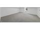 Bright attic space with neutral carpet and a window providing natural light at 1309 Briar Patch Ln, Raleigh, NC 27615