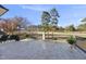 Spacious back porch with tile flooring and an iron railing overlooking the beautiful golf course at 1309 Briar Patch Ln, Raleigh, NC 27615