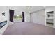 Spacious bedroom featuring a fireplace, outdoor access, and en suite bath at 1309 Briar Patch Ln, Raleigh, NC 27615