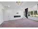 Bedroom featuring a modern fireplace, walk-out access, and a golf course view at 1309 Briar Patch Ln, Raleigh, NC 27615