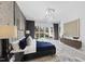 Bright bedroom featuring a view of the outside, modern lighting, and stylish décor at 1309 Briar Patch Ln, Raleigh, NC 27615