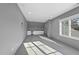 Bonus room featuring a wet bar and an abundance of natural light at 1309 Briar Patch Ln, Raleigh, NC 27615