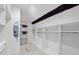 Bright, walk-in closet with custom shelving and stylish decor at 1309 Briar Patch Ln, Raleigh, NC 27615