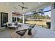 An elegant covered patio with comfortable seating offers stunning views of the golf course at 1309 Briar Patch Ln, Raleigh, NC 27615