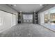 Bright home theater boasts a large screen, built-in shelving, stylish sliding door, and easy patio access at 1309 Briar Patch Ln, Raleigh, NC 27615