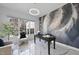 Modern office space with stylish desk, feather accent wall, bright window, and comfortable seating at 1309 Briar Patch Ln, Raleigh, NC 27615