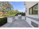 This outdoor kitchen features a stainless steel grill, concrete countertops, and a stone tile floor at 1309 Briar Patch Ln, Raleigh, NC 27615