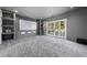 Home theater with tiered seating, projector screen, and surround sound at 1309 Briar Patch Ln, Raleigh, NC 27615