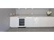 Wet bar featuring modern cabinets, quartz counters, and a wine fridge at 1309 Briar Patch Ln, Raleigh, NC 27615