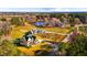 Aerial view of homes and a pond at 145 Wiggins Rd, Louisburg, NC 27549