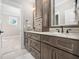 Elegant bathroom with double vanity, granite countertop, and ample storage at 145 Wiggins Rd, Louisburg, NC 27549