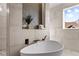 Bathroom with a freestanding tub and unique tilework at 145 Wiggins Rd, Louisburg, NC 27549