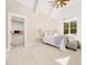 Spacious bedroom with vaulted ceiling, window, and carpet at 145 Wiggins Rd, Louisburg, NC 27549
