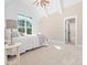 Spacious bedroom with vaulted ceiling, window, and carpet at 145 Wiggins Rd, Louisburg, NC 27549