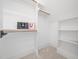 White closet with shelving and hanging rods at 145 Wiggins Rd, Louisburg, NC 27549