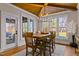 Elegant dining room features a wooden table, chandelier, and access to backyard at 145 Wiggins Rd, Louisburg, NC 27549