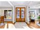 Grand entryway with double doors and hardwood floors at 145 Wiggins Rd, Louisburg, NC 27549