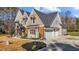 Two-story home with stone and siding exterior at 145 Wiggins Rd, Louisburg, NC 27549