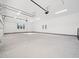 Large garage with ample space for storage and vehicles at 145 Wiggins Rd, Louisburg, NC 27549