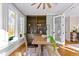 Bright home office features built-in shelving, hardwood floors and a view of the backyard at 145 Wiggins Rd, Louisburg, NC 27549