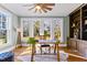 Home office with built in shelves, hardwood floors, and plenty of natural light at 145 Wiggins Rd, Louisburg, NC 27549