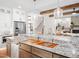 Kitchen island with granite countertop and sink at 145 Wiggins Rd, Louisburg, NC 27549