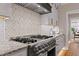 Stainless steel range with designer backsplash at 145 Wiggins Rd, Louisburg, NC 27549