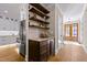 Kitchen features a wine cooler, granite countertops and custom cabinetry at 145 Wiggins Rd, Louisburg, NC 27549
