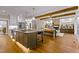 Modern kitchen with large island and hardwood floors at 145 Wiggins Rd, Louisburg, NC 27549