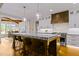 Gourmet kitchen boasts a large island, stainless steel appliances, and granite countertops at 145 Wiggins Rd, Louisburg, NC 27549