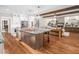 Modern kitchen with large island and stainless steel appliances at 145 Wiggins Rd, Louisburg, NC 27549