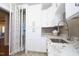 Bright laundry room with built-in storage and a folding station at 145 Wiggins Rd, Louisburg, NC 27549