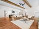 Spacious living room with hardwood floors and kitchen view at 145 Wiggins Rd, Louisburg, NC 27549