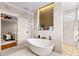 Elegant bathroom featuring a freestanding tub and walk-in shower at 145 Wiggins Rd, Louisburg, NC 27549