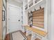 Functional mudroom with built-in bench, cubbies, and hooks for coats at 145 Wiggins Rd, Louisburg, NC 27549