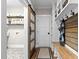 Convenient mudroom features a built-in bench, storage, and access to laundry room at 145 Wiggins Rd, Louisburg, NC 27549