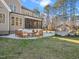 Spacious patio with comfortable seating and fire pit at 145 Wiggins Rd, Louisburg, NC 27549