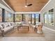 Relaxing screened porch with comfortable seating and wood ceiling at 145 Wiggins Rd, Louisburg, NC 27549