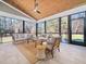 Relaxing screened porch with comfortable seating and wood ceiling at 145 Wiggins Rd, Louisburg, NC 27549