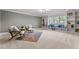 Cozy sitting room featuring built-in shelving and a comfy rug at 145 Wiggins Rd, Louisburg, NC 27549