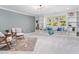 Cozy sitting room featuring built-in shelving and a comfy rug at 145 Wiggins Rd, Louisburg, NC 27549
