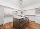 Spacious walk-in closet with custom shelving and island at 145 Wiggins Rd, Louisburg, NC 27549