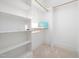 Spacious walk-in closet with ample shelving and hanging space at 145 Wiggins Rd, Louisburg, NC 27549