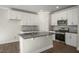 Kitchen with white cabinetry, stainless steel appliances, center island with sink, and recessed lighting at 1817 Hinesley Dr, Durham, NC 27703
