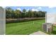 Well-maintained backyard featuring green grass, a privacy fence, and an air conditioning unit at 1825 Hinesley Dr, Durham, NC 27703