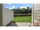 Back patio with a view of the lush backyard and a privacy fence, perfect for outdoor enjoyment at 1825 Hinesley Dr, Durham, NC 27703