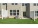 Cozy backyard space with green grass, a privacy fence, and access to the home at 1825 Hinesley Dr, Durham, NC 27703